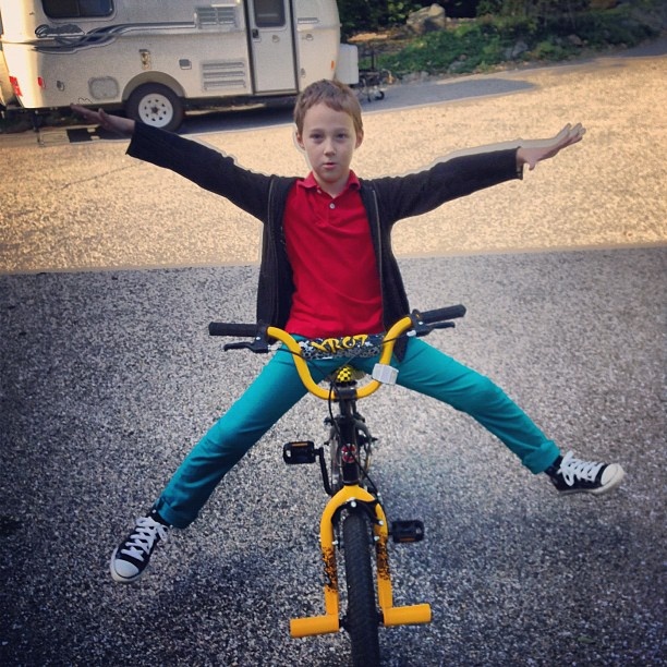 Arlo decides *balance* is the first step in learning to ride a bike. Taken by Jeff Robbins, see https://www.flickr.com/photos/jjeff/8044894523