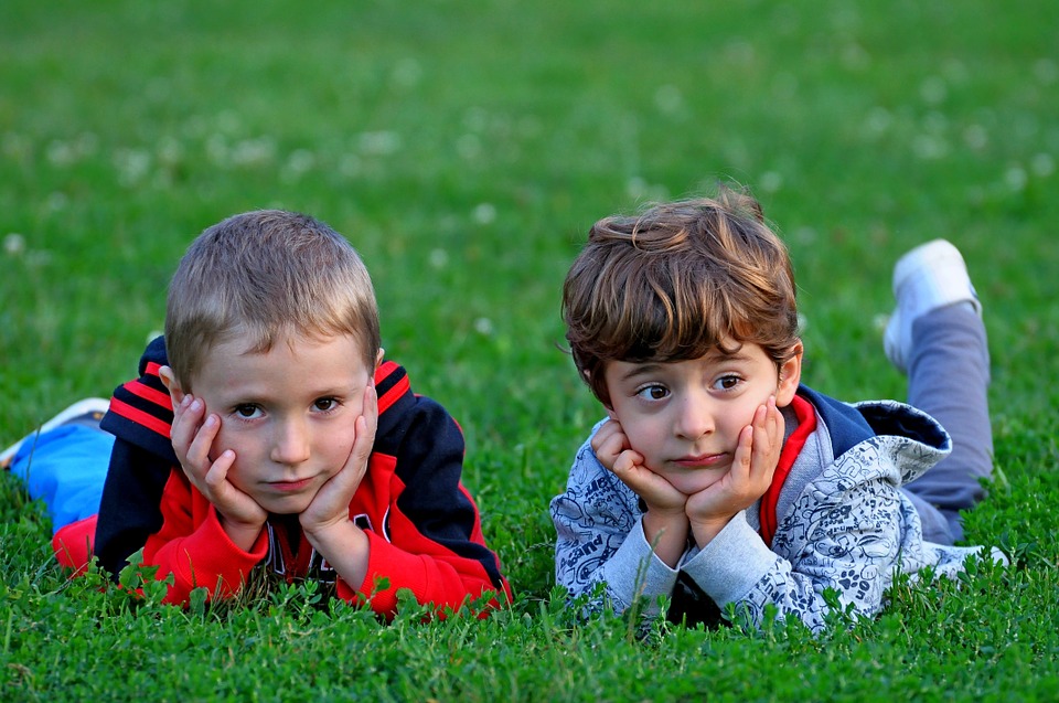 children lying in grass - do you need surgery