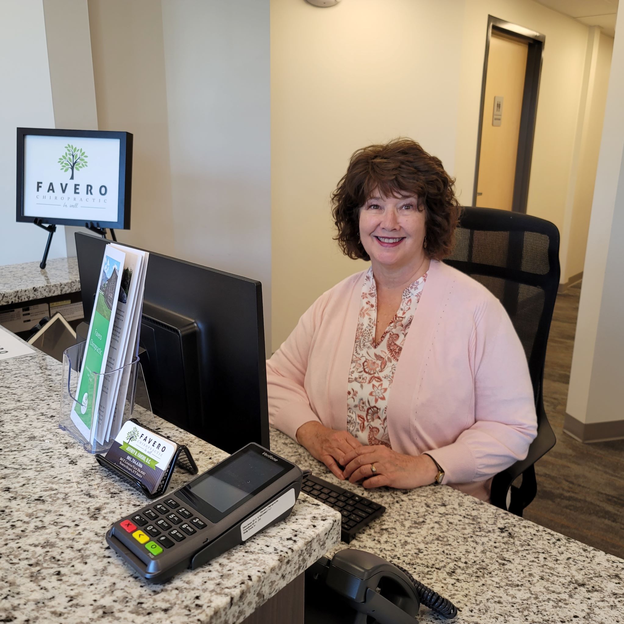 front desk receptionist at chiropractic clinic